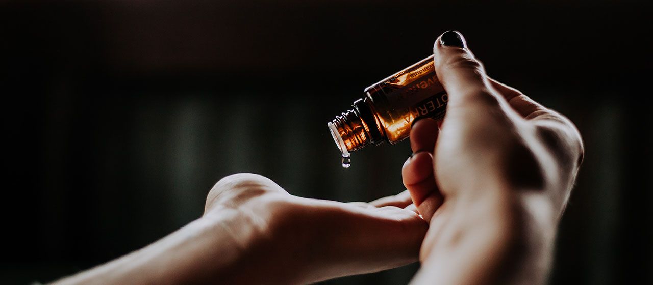 CBD oil being dripped on to a hand