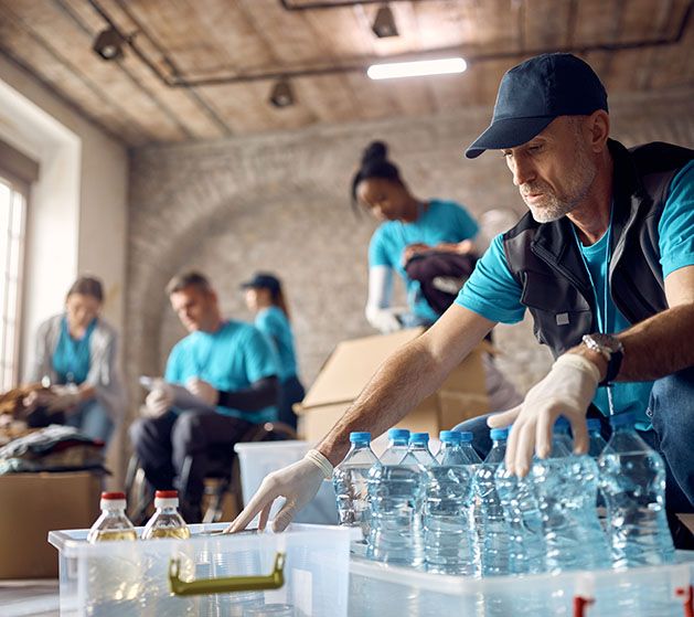 Volunteers packing emergency supplies for local community non-profit