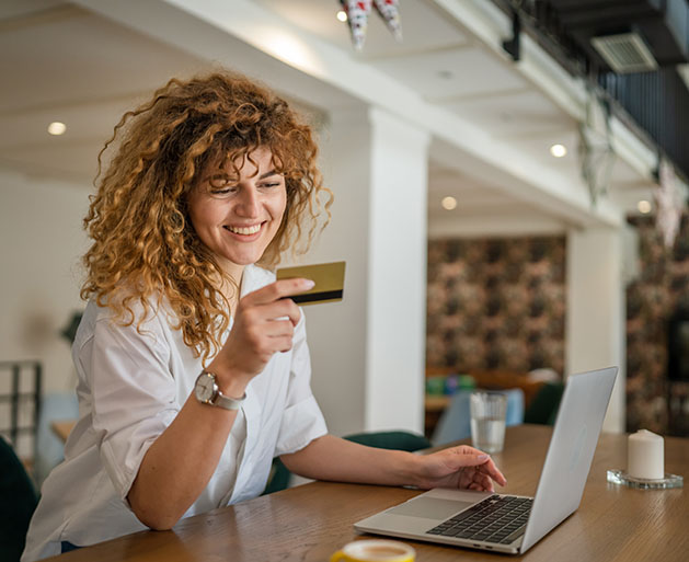 A woman inputting her credit card information online