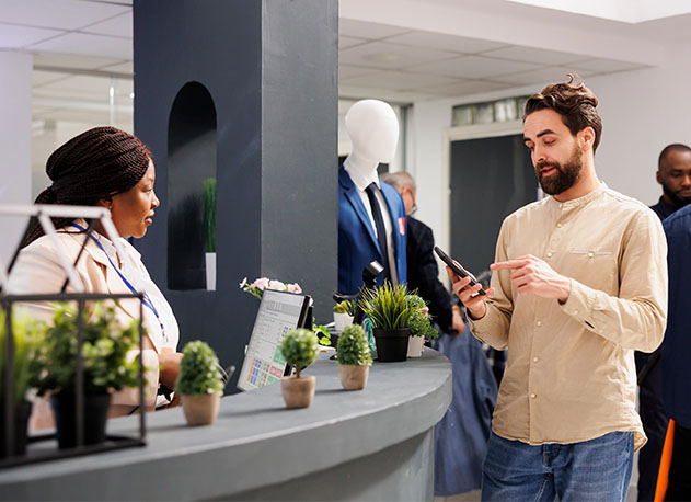 A man using claiming loyalty rewards at a shop counter