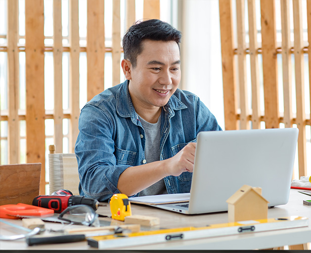 A contractor on a laptop who is relieved that their data is encrypted for added security