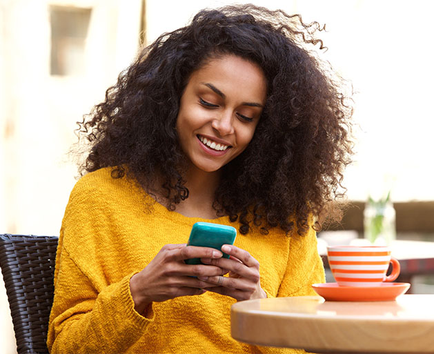 A woman easily updating her payment info on a dating app thanks to North POS systems