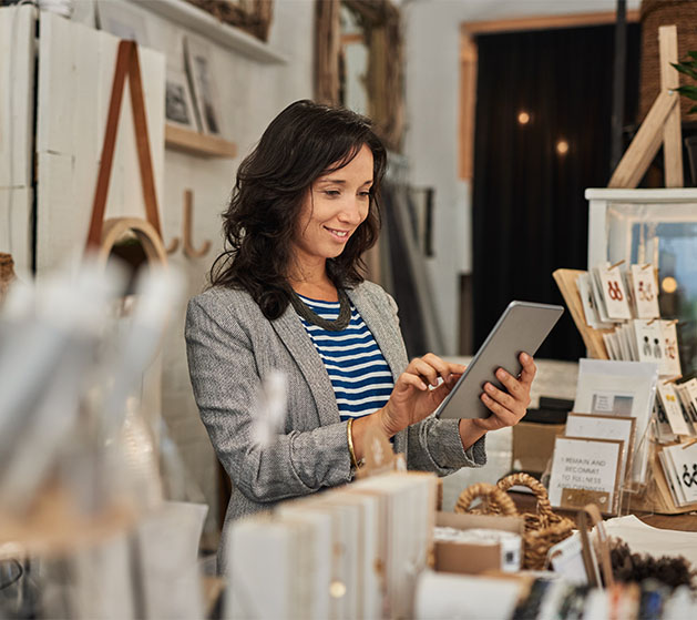 A shop keeper enjoying the inventory management services from North Payments Hub app