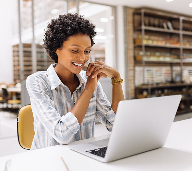 A woman exporting sales data to QuickBooks Online using North POS Systems