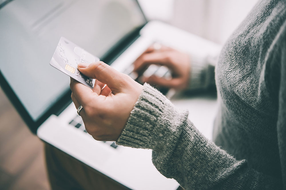 woman paying online with credit card